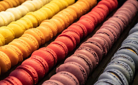 Macarons assortment background texture. French store display, close up view with detailsの写真素材