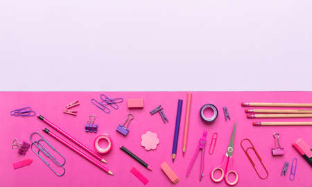 Back to school. School office supplies pink, purple color on pink background, top view, copy spaceの写真素材