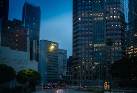 Los Angeles California USA. June 1st, 2019. Skyscrapers illuminated, car lights on the street, blue...