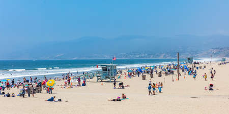California USA. May 30, 2019. People on sandy Santa Monica beach. Pacific ocean coastline Los Angeles. Blue sky and seaのeditorial素材