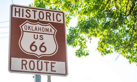Route 66, Oklahoma. Brown color road sign at Tulsa OK, sunny day, Route 66 the classic historic...
