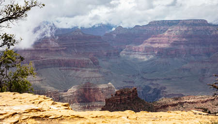 Grand Canyon National park, Arizona, United States. Overlook of the red rocks, cloudy sky backgroundの写真素材