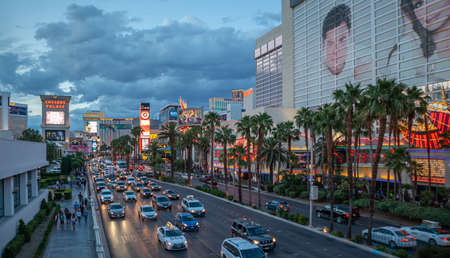 Las Vegas Nevada, USA. May 27, 2019. Las vegas strip aerial view in the evening. Colorful neon signs and ads, crowd and cars, cloudy skyのeditorial素材