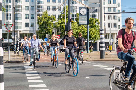 Rotterdam, Netherlands. June 27, 2019. People riding bikes in the city center, Spring sunny dayのeditorial素材