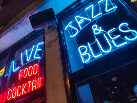 Chicago, Illinois USA. May 10, 2019.  Nightlife with Jazz and Blues music. Retro bar with red and blue neon sign. Food and coctailsのeditorial素材