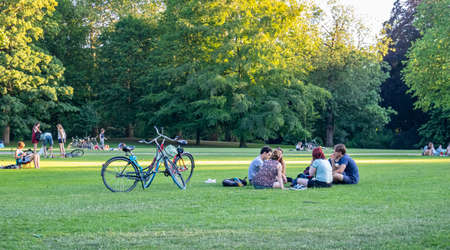 Rotterdam, Netherlands. June 29, 2019. People resting on the grass in a summer afternoon, city park backgroundのeditorial素材