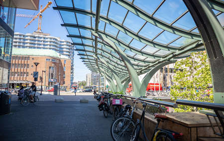 Rotterdam, Netherlands. June 27, 2019. Bikes parked on a sidewalk in the city centerのeditorial素材