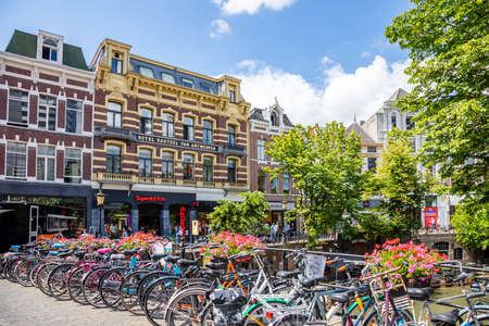 Utrecht Netherlands. July 1st, 2019. Bikes parked on a sidewalk in the city centerのeditorial素材