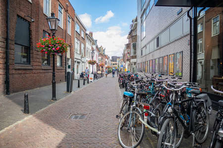 Utrecht Netherlands. July 1st, 2019. Bikes parked on a sidewalk in the city centerのeditorial素材
