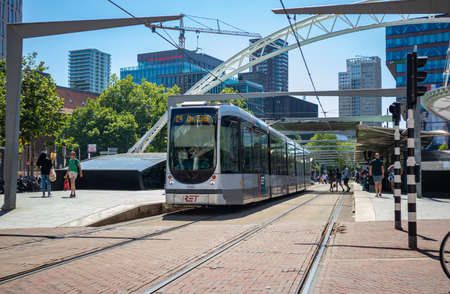 Rotterdam Netherlands, June 29 2019. Tram in the city center, office buildings background, sunny dayのeditorial素材