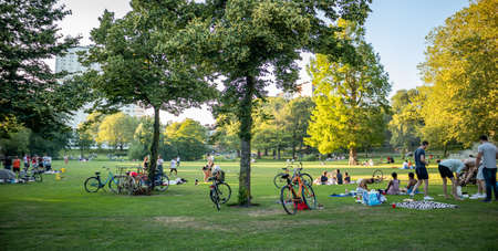 Rotterdam, Netherlands. June 29, 2019. Picnic on the grass, people relaxing, summer afternoon in a city parkのeditorial素材