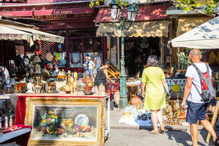 Athens, Greece - August 4, 2019: Monastiraki flea market. People walking along street with artwork for sale on market in historical centerのeditorial素材