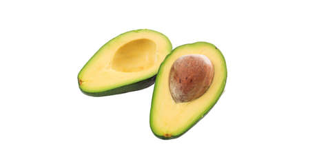 Avocado fresh cut in two halves isolated cut out against white background, close up view