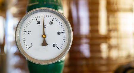 Industrial thermometer, Temperature gauge control, celsius scale, old, dial, blur industrial backgroundの写真素材