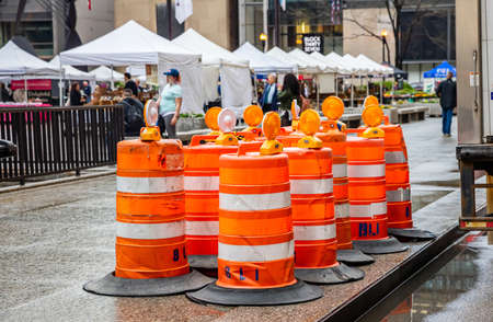 Chicago, Illinois, US. May 9, 2019: Road works. Road construction ahead text, road warning sign orange color in the city centerのeditorial素材