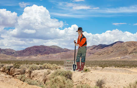 Calico ghost town California, USA. May 29, 2019. Man miner with a shovel, Calico theme park signpostのeditorial素材