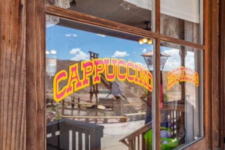 Calico ghost town California, USA. May 29, 2019. Calico cafe sign cappuccino on glass window, wood building facadeのeditorial素材