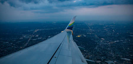 New York USA. June 3, 2019. Alaska airlines plane approaching Newark airport in the evening, view out of an airplane window.のeditorial素材
