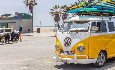 Los Angeles California USA. May 30, 2019. Venice beach, Surf boards stacked on a yellow van roof, surf school adv, sunny spring dayのeditorial素材