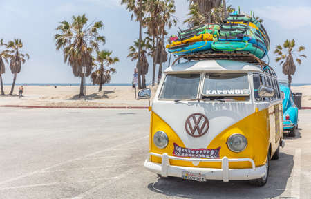 Los Angeles California USA. May 30, 2019. Venice beach, Surf boards stacked on a yellow van roof, surf school adv, sunny spring dayのeditorial素材