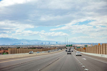 Las Vegas Nevada, USA. May 27, 2019. Cars on the road driving to Las Vegas city, cloudy blue sky backgroundのeditorial素材