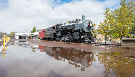 Williams Arizona USA. May 23, 2019. Grand canyon railway, retro historic locomotive at the train station. Reflections on rain waterのeditorial素材