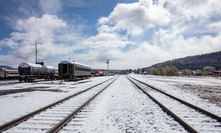 Williams Arizona USA. May 23, 2019. Retro historic trains at the station. Snowy day, Tracks and wagons covered with snowのeditorial素材