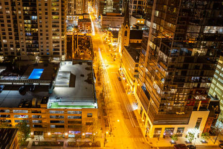 Chicago, Illinois, USA, May 9, 2019. Above view of skyscrapers in Chicago. Glass buildings reflecting the lights of the highway at night.のeditorial素材