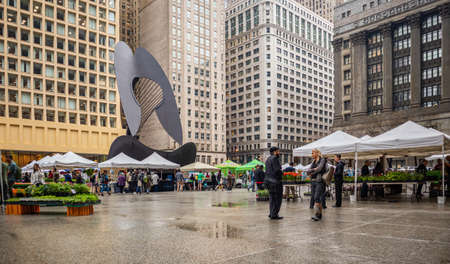 Chicago, Illinois, USA, May 9, 2019. Untitled massive sculpture from Pablo Picasso at Daley Plaza, Skyscrapers background, people around.のeditorial素材