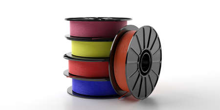 3D printer filaments. Reels of colorful plastic wire for 3D printing isolated on white background....