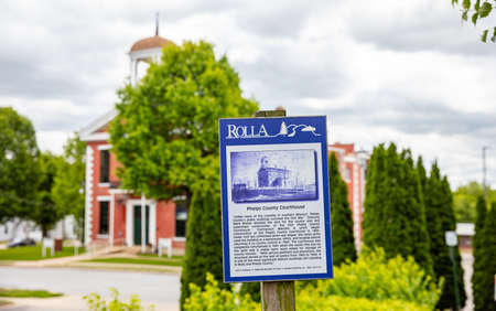 Rolla, Missouri, USA. May 12, 2019. The Old Phelps County Courthouse history on a board. An information text for the tourists. Blur building background.のeditorial素材