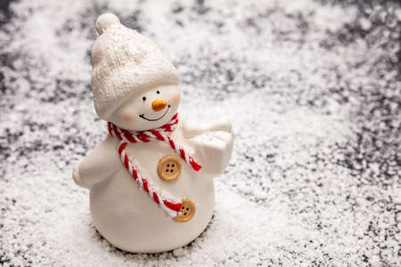 Christmas snowman on snow background, copy spaceの写真素材