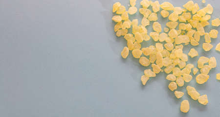 Mastic resin tears. Chios mastic on blue grey background, copy spaceの写真素材