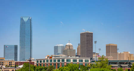 Oklahoma, USA. May 13, 2019. Okc city under american blue sky. Metropolis with skyscrapers and modern buildings. Panoramic view.のeditorial素材