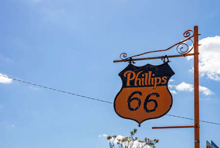 Amarillo, Texas USA. May 14, 2019. Phillips 66 vintage metal sign mounted on metal pole, next to mother road route 66. Space, blue sky background.のeditorial素材
