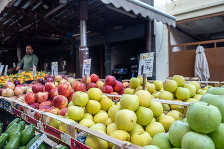 Athens, Greece. November 14, 2019. Man selling Fruits at a street market stall. Central food market of the city outdoors shops.のeditorial素材