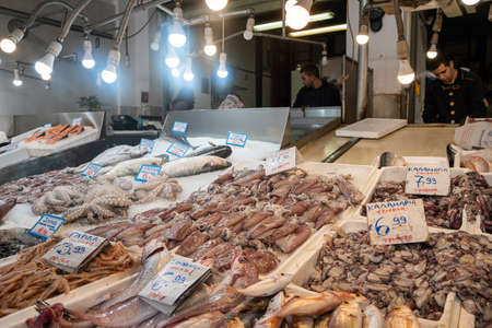 Athens, Greece. November 14, 2019. Fish and seafood variety at a fish market stall. Central food market of the city, interior viewのeditorial素材