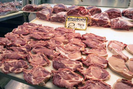 Athens, Greece. November 14, 2019. Uncooked steaks  at a meat market stall. Central food market of the cityのeditorial素材