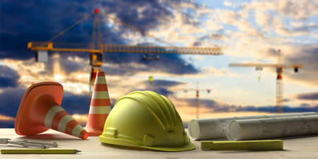 Contractor site office concept. Project construction blueprints and engineering tools on wooden desk, blur construction cranes and sky background. 3d illustrationの写真素材