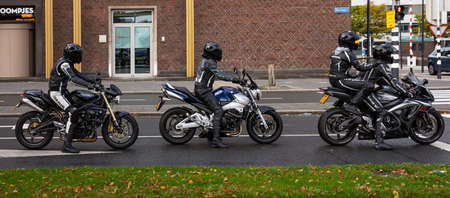 Rotterdam, Netherlands. October 13, 2019. Group of motorcyclists in leather clothing and helmets,...