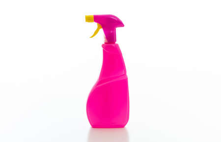 Cleaning spray bottle with pink and yellow trigger isolated against white background. Chemical detergent product no name template, blank empty label, copy spaceの写真素材
