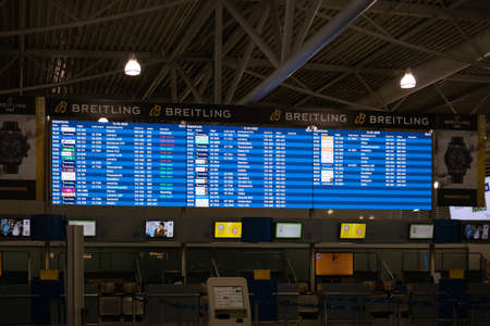 Athens Greece, March 3rd 2020. Airport terminal building interior. Check in counters hall empty in coronavirus daysのeditorial素材