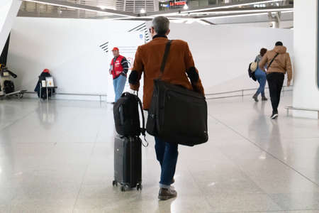 Athens Greece, March 3rd 2020. Airport terminal building interior. Back view of traveller...