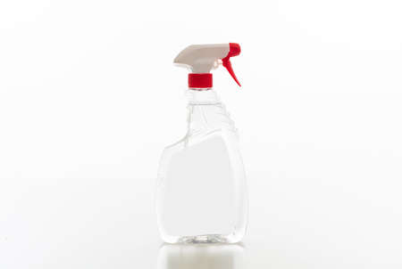 Cleaning spray bottle clear with red trigger isolated against white background. Chemical detergent product no name template, blank empty label, copy spaceの写真素材