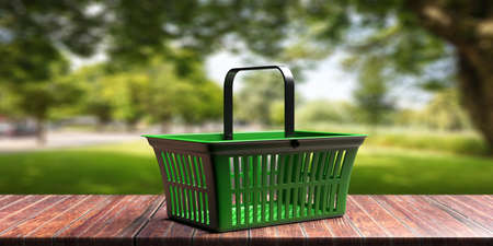 Fresh bio groceries shopping concept. Green empty shopping basket against blur nature background. 3d illustrationの写真素材