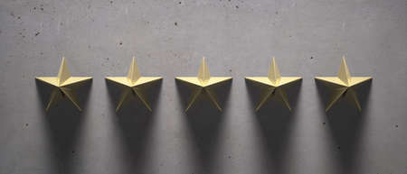 5 stars gold color sign. Shiny brass five stars on concrete stone background, luxury, elegance, quality concept. 3d illustrationの写真素材