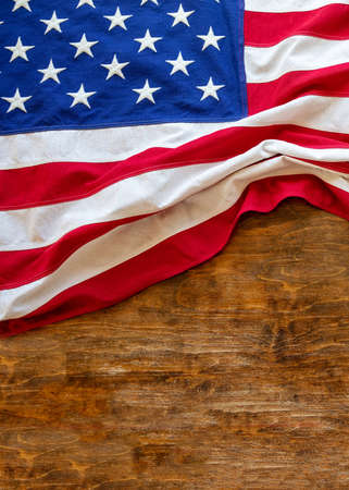 USA  flag on wooden table background. American flag top view, copy space. Memorial day and 4th of July, Independence day mockup, templateの写真素材