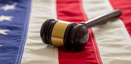 Judge or auction gavel on United states of America flag background. Justice and law in USA conceptの写真素材