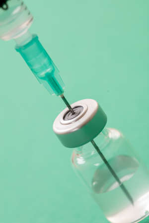 Vaccine, coronavirus vaccination, covid-19 flu prevention, immunization concept. Vial dose and...