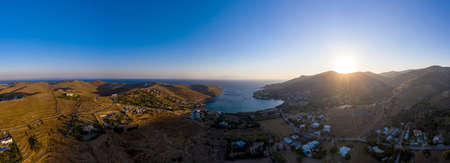 Kea Tzia island, Cyclades, Greece. Panorama of Otzias bay at sunrise. Sun coming up at dawn behind...
